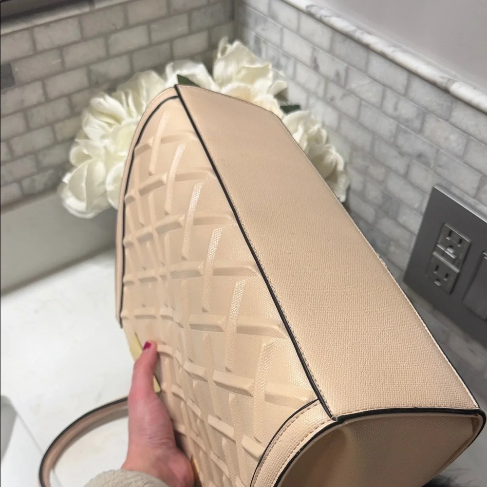 Elegant Cream Handbag with Black Charm